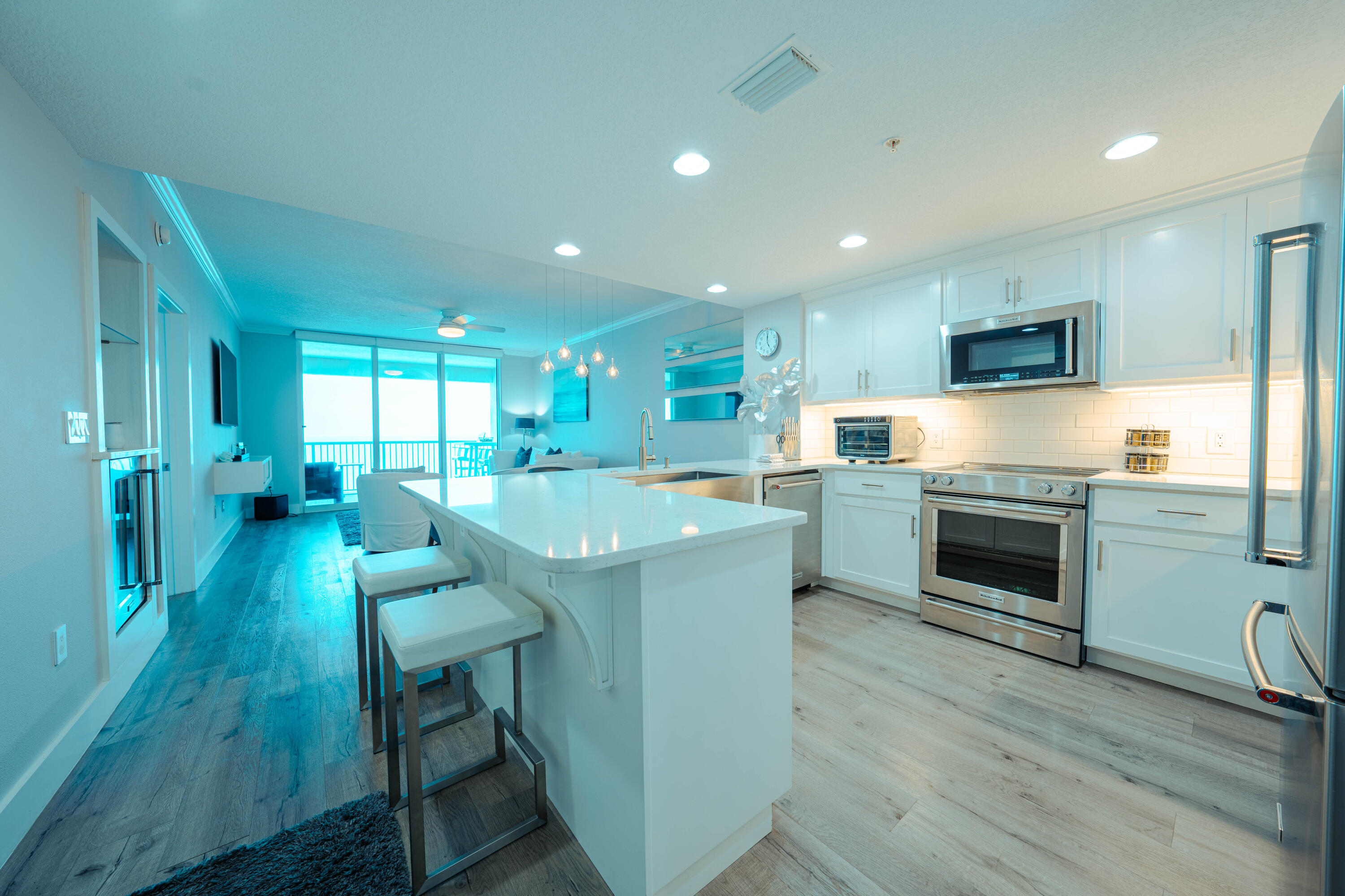 Coastal luxury condo with all the upgrades.  The kitchen features all Kitchen Aid appliances including the mini fridge in the wet bar.  Monte Carlo fans and Lutron motorized shades ensure a relaxing environment.  The bathroom features a walk in shower with multiple heads, dual sinks, separate lavatory, and extra storage.  Shiplap and barn doors add to the coastal feel throughout the condo.  The large balcony is private and cannot be viewed from other condos in the building.  In addition to the two full bedrooms, there is a full size bunk room, as well as a full size front load washer and dryer set.  Currently bunk room is being used as an office.  Palazzo features a parking garage under the building with secured covered parking.  You will not find a nicer condo.