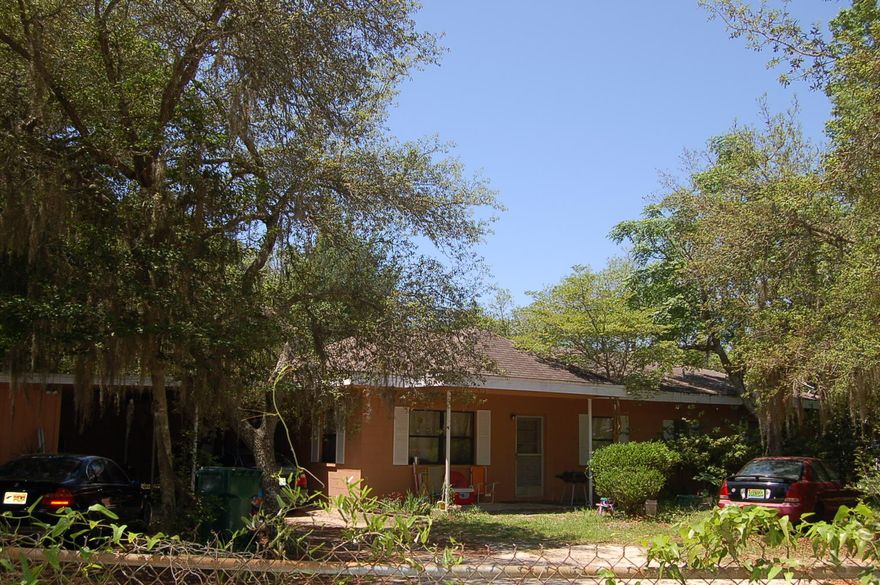 OH THE POSSIBILITIES! Family home on large corner lot. Fenced yard with lots of room for the kids to play or have that garden you've always wanted. Two car carport with two storage areas. Step into a natural lit living room. The eat in kitchen steps down into the family room with a cozy fireplace. Master Bedroom is accompanied by three additional guest bedrooms and a full guest bathroom. Home sits on over half an acre and could possibly be three buildable sites lot 7, 8 and 10. Check it out located across from the bayou!