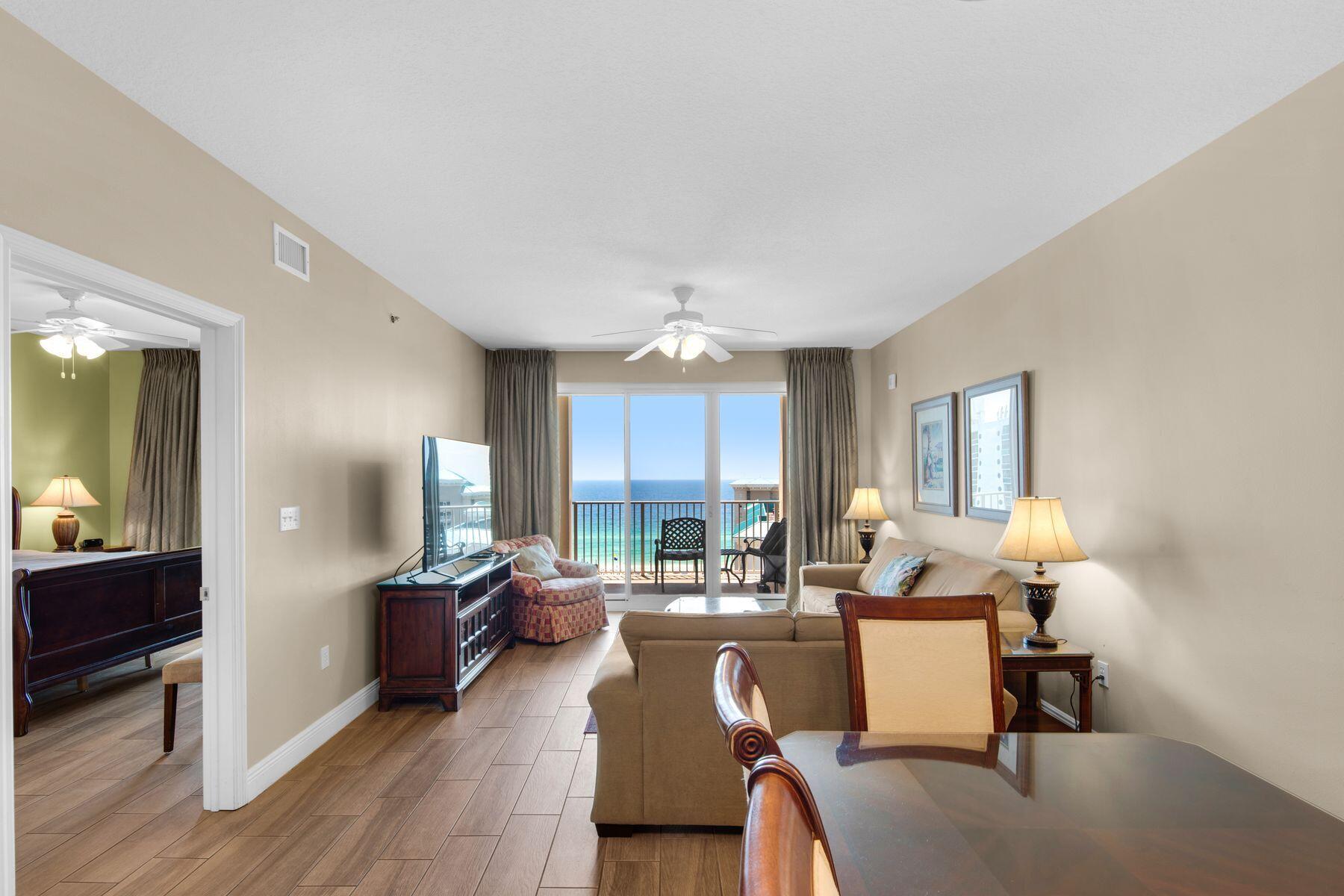 Stunning gulf views greet you as you enter this impressive 14th-floor condo at Ariel Dunes. Well maintained, it rents and lives like a three-bed unit with two full bedrooms and bathrooms, plus a cozy bunk room with two built-in bunks and a privacy door. A sleeper sofa in the sitting room can also accommodate overnight guests. Tile floors provide a seamless flow from the bright and welcoming living/ dining areas to the well-appointed kitchen. Maple cabinets, granite countertops and white appliances provide everything you need to serve snacks and drinks or more ambitious family meals. A high-top bar with stools creates a natural spot for serving breakfast or cocktails, but you'll probably prefer to dine alfresco in the fresh sea air. The deep furnished balcony stretches the full width width of the unit, with sliding doors providing uninterrupted views from the sitting room and master bedroom. Look forward to outdoor living, dining and entertaining with east and west views and stunning sunsets year-round. Ride the elevator to the ground floor, where a host of amenities include two swimming pools, an on-site restaurant, an 18-hole golf course, tennis, a fitness suite and a conference center. This gated gulf-front resort also boasts deeded beach access to more than 2,000 feet of stunning white sand for fishing, shelling and dolphin-spotting in the emerald gulf waters. The on-site Cabana Cafe provides live entertainment as well as in-house dining and room service. The vibrant Seascape Towne Centre has additional choices for dining, shopping and nightlife, along with an arcade, coffee shop and beach gear rentals. This fully furnished beach retreat includes a newer washer/dryer, new HVAC (2023) and LCD TVs in the bedrooms and living room. 