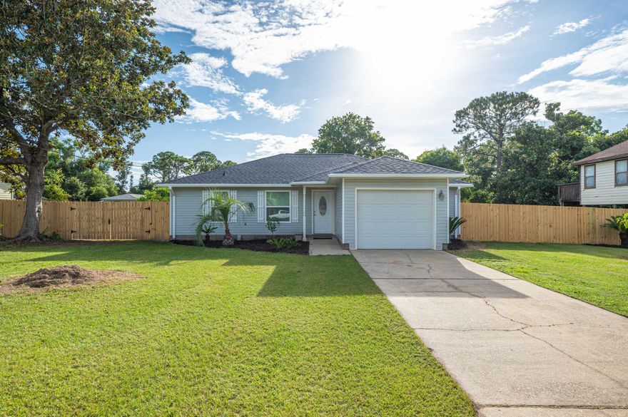 Located on Innerarity Point, this home offers a fully renovated kitchen with a new roof (2021) and new HVAC inside and out (July 2022). You'll enjoy the brand new fenced back yard with an awesome brand new deck (21'x12') perfect for entertaining family and friends. Newly renovated with all new interior paint, ceiling fans, new vinyl flooring and new carpet in all bedrooms. The kitchen comes equipped with stainless steel appliances, electric cooktop, pantry, granite countertops with an island with breakfast bar. The primary suite is suitable for a king-size bed and has a walk-in closet and new marble top vanity with all new fixtures. The two additional bedrooms located on the opposite side of the home share a hall bathroom with a shower/tub combo and new Quartz vanity with all new fixtures.