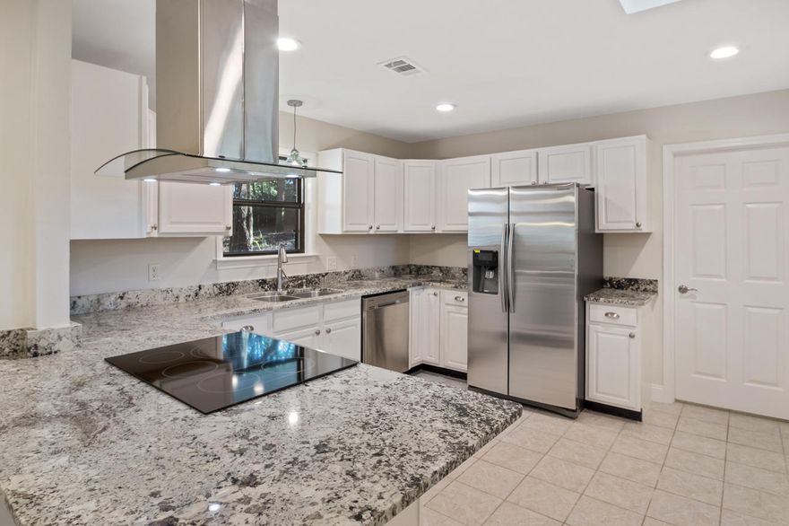 Beautifully remodeled 2 bedroom, 2 bathroom home in central Niceville is now available. This home features hardwood floors or tile throughout and is ready for its new owner. The kitchen is spacious and features granite counters and stainless steel appliances along with a wrap around eat at breakfast bar. The two bedrooms are spacious and both bathrooms have been updated with new vanities and custom tile shower surrounds. The living room features hardwood floors and a wood burning fireplace that has access to the covered screened in porch. New lighting throughout including recessed lighting in the kitchen. Come see this home today.