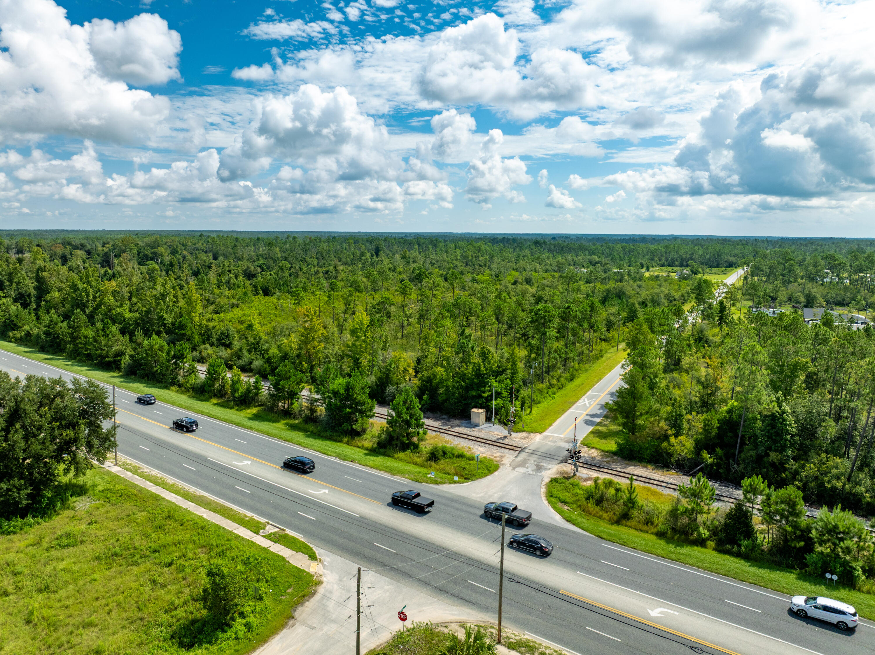 Don't miss this rare chance to own 19 acres of prime Florida land on the corner of Hwy 231 & Webber Rd in Fountain, FL. With excellent highway frontage, this property offers unlimited development potential, ideal for a residential subdivision, multi-home estate, RV park, farm, or recreational retreat. Located just 25 m from downtown Panama City, 35 m from Panama City Beach, & only 30 miles to Northwest Florida Beaches International Airport (ECP), the parcel combines peaceful rural living with easy access to the Gulf Coast's white-sand beaches, shopping, dining, and entertainment. Whether you're a developer, investor, or builder, this large tract presents a unique opportunity in a fast-growing area of the Florida Panhandle. Purchase your slice of Florida's future, the possibilities endless