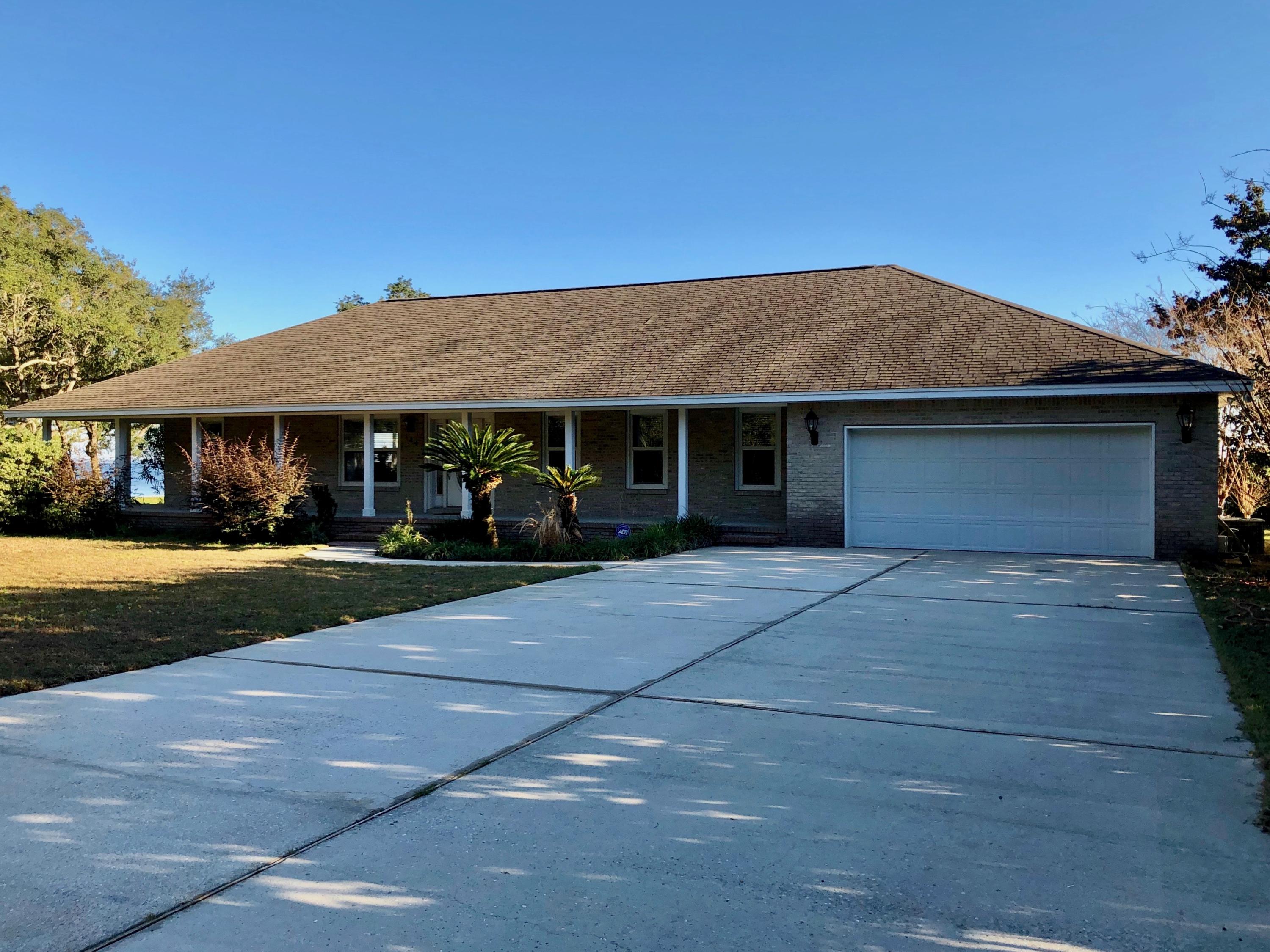 An amazing view from east to west on Choctawhatchee Bay. Conveniently located from Bluewater Bay and Freeport for shopping, restaurants, medical and recreation. Enjoy approximately 100' of waterfront viewing out your kitchen, living room, dining area, master bedroom, laundry & extra room. This open floor plan with kitchen, dining area and living room view of Choctawhatchee Bay! Home has 2 bedrooms, 2 baths with tiled flooring in the bathrooms, kitchen, dining area, laundry and extra open room off of garage. The kitchen has an amazing amount of cabinets for storage, all appliances convey (refrigerator, microwave, stove and dishwasher). Large countertop with area to seat 5 people with a dining area for additional seating. Carpet in the living room, hall and both bedrooms.