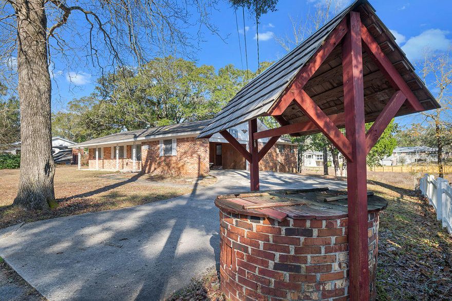 Sitting on over 0.6 acres with a yard size that's increasingly hard to find, this well designed  ranch style home in Niceville offers a rare combination of space, functionality, and future income potential!  The open concept floor plan creates a natural flow between the main living spaces, anchored by a fireplace in the living room. Double French doors open from the main living area and kitchen to a large deck, making the home ideal for entertaining both indoors and out. A dedicated wet bar, wine fridge, and two refrigerators elevate the hosting experience, while the kitchen is equipped with a flat-top stove and overhead microwave for everyday efficiency. All bedrooms are generously sized, including a spacious primary suite featuring a large master bedroom and walk in closet. The oversized laundry room adds exceptional functionality with a utility sink, built-in cabinetry, and a wide folding countertop.

The property is well-equipped with full gas service, electric, a lawn pump, a well in the front of the property, and a tankless water heater. For added flexibility, the home includes full RV hookups, making it ideal for recreational use or visiting guests.

A standout feature is the unfinished basement, already stubbed with sewer, plumbing, and electrical, and offering a separate private entrance providing a strong opportunity for an income-producing suite, guest quarters, or multi-generational living.

Whether you're looking for space to entertain, room for hobbies and RV storage, or the opportunity to add a private suite for additional income, this home offers a level of versatility that's increasingly rare in Niceville. Schedule your private showing today and see firsthand how this property can be perfect for your primary and investment goals!
