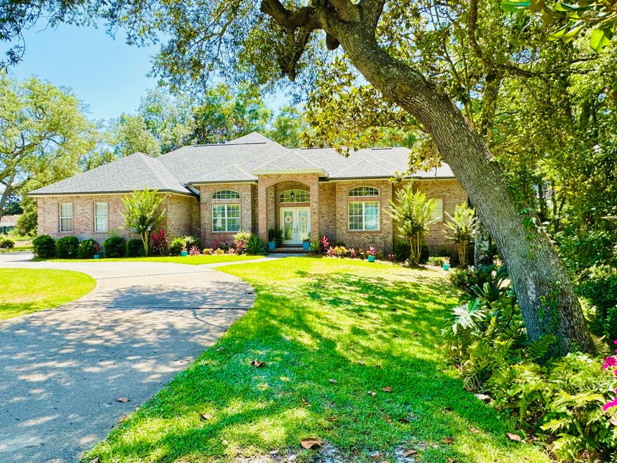 BEAUTIFUL custom-built home on the LARGEST LOT in Magnolia Plantation.  This spacious home features SIX BDRMS and FIVE BTHRMS.  POOL AND JETTED HOT TUB are situated on an inner courtyard giving most rooms a GORGEOUS VIEW to the pool.  The screened in pool area has a newly installed epoxy deck & a GE Monogram Vented Gas Grill.  The home backs up to conservation and includes 13-foot TREY CEILINGS, GAS FIREPLACE, crown molding and bull-nose corners.  4-Car garage has custom high ceilings.  For extra hurricane protection, the attic walls are sheathed with 5/8'' Plywood from floor to ceiling.  There is extra insulation in the ceilings. This home also includes a WHOLE HOUSE DEHUMIDIFIER, SURROUND SOUND in the family room, NEW LED LIGHTING, & Dual GE smart water heaters.