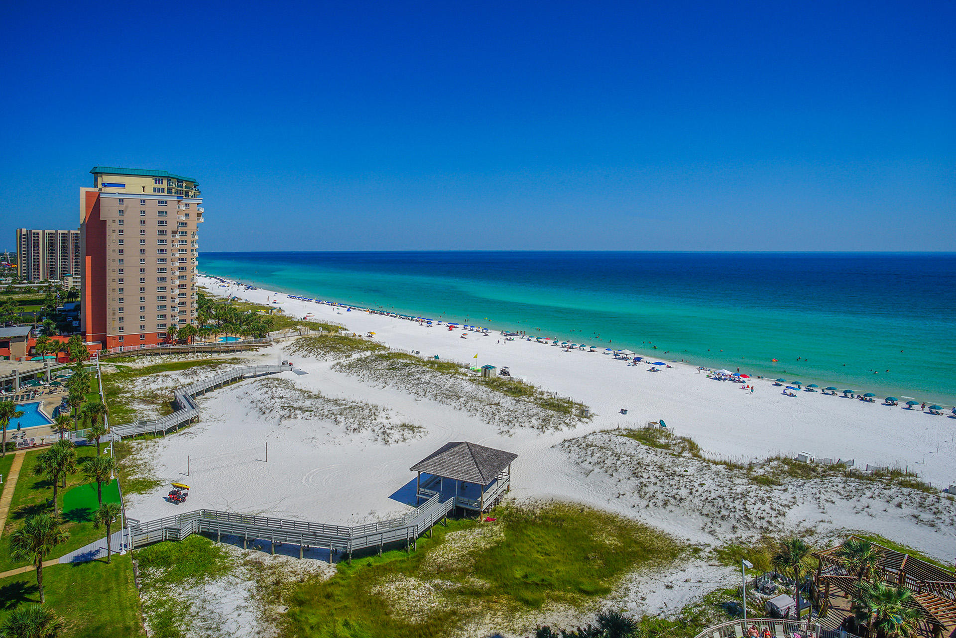 Amazing Gulf Views from this 11th Floor Turn Key Rental Machine! Relax on the Balcony and Breath in the Fresh Gulf Air while Enjoying Beautiful Views and Breezes from the Emerald Coast. This stack of units is close to the beach, and the Unit is Completely Updated and Freshly Painted. Kitchen is beautifully appointed with Breakfast Bar, Stainless Appliances and Views of the Gulf. Professionally Designed Space and Furniture for your Family or Rental Guests. Gross Rentals of ~$38,000 Per Year! 24 Hour Front Desk and Security as well as On-Site Manager. Pelican Beach Resort brings Deeded Beach Access and also offers several amenities including Indoor/Outdoor Pool, Hot Tub, Tiki Bar, Fitness Center, Tennis, Picnic Area, Fire Pits and on and on..!