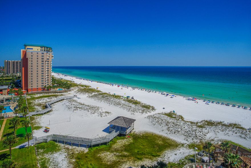 Amazing Gulf Views from this 11th Floor Turn Key Rental Machine! Relax on the Balcony and Breath in the Fresh Gulf Air while Enjoying Beautiful Views and Breezes from the Emerald Coast. This stack of units is close to the beach, and the Unit is Completely Updated and Freshly Painted. Kitchen is beautifully appointed with Breakfast Bar, Stainless Appliances and Views of the Gulf. Professionally Designed Space and Furniture for your Family or Rental Guests. Gross Rentals of ~$38,000 Per Year! 24 Hour Front Desk and Security as well as On-Site Manager. Pelican Beach Resort brings Deeded Beach Access and also offers several amenities including Indoor/Outdoor Pool, Hot Tub, Tiki Bar, Fitness Center, Tennis, Picnic Area, Fire Pits and on and on..!