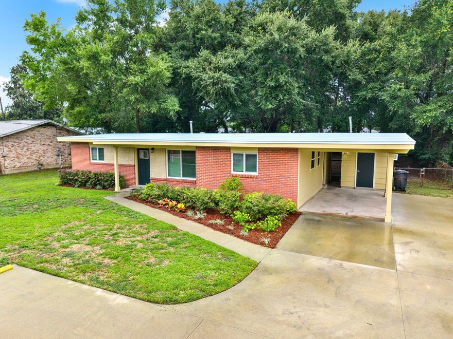Seller is offering a Buyers Credit for Closing Costs & Prepaids at closing with acceptable offer.  New roof - Brand new appliances - including washer and dryer - New quartz kitchen countertops - New impact resistant windows - New water heater - Fresh paint throughout - New exterior & interior doors - New bypass closet doors with mirrors in all of the bedrooms - Beautiful Terrazzo floors throughout - There is a separate heated & cooled 152 sq. ft. laundry/utility room with an additional area that could be used as a home office, craft room or whatever you need. This home has a large, fenced backyard with wonderful, mature Live Oak trees. There is even a new sidewalk & driveway with a turn around.  Home comes with a 1 year home warranty!