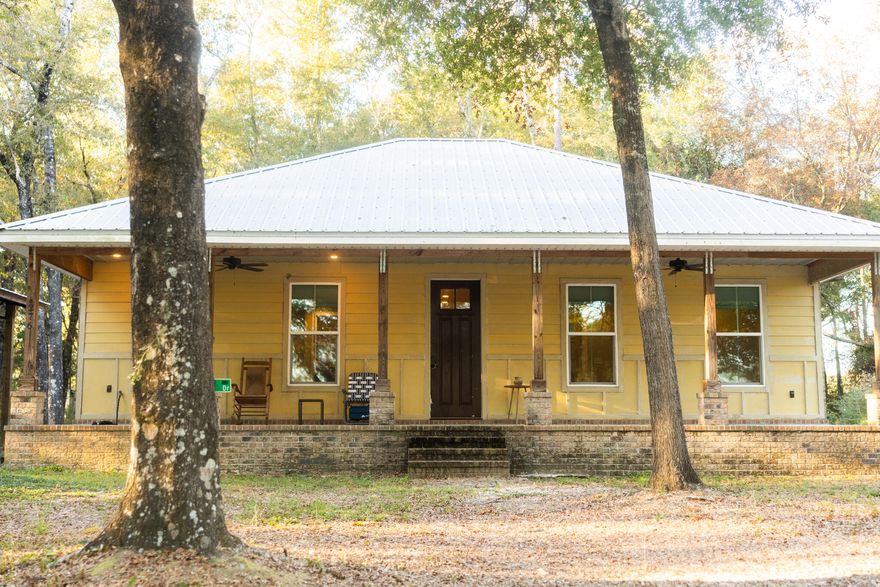 Welcome home to your custom craftsman escape on Lake Juniper, where peaceful living and unforgettable sunsets welcome you every day. This charming home features 1,000+ sq ft, an open, inviting layout, a large walk-in shower, and a true laundry room--all designed for comfort and ease.Set on just over an acre, the property offers a long driveway framed by gorgeous trees, a relaxing front yard and covered patio overlooking the lake, and a convenient covered carport. Whether you're sipping coffee at sunrise or winding down as the sun sets over the water, this home delivers a serene lakefront lifestyle.Looking for even more space? An additional acre behind the property is also available for purchase. This is your chance to own a private lakefront sanctuary with room to expand.