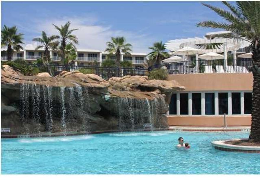 SHORT SALE...Lowest priced unit in Waterscape! #A119 is a FURNISHED, first level, 1,292 sqft, 2br/2.5ba with bunks. This floor plan is nicely designed with both bedrooms and living room having access to the balcony. The bedrooms suites are nicely appointed with king size beds, full baths with garden tubs and stand up showers. Interior features include stainless steel appliances, granite counter tops, 8' deep balconies, floor to ceiling glass doors, and breakfast bar. Enjoy Waterscape amenities, the sugar white sand beaches and emerald waters of the Gulf of Mexico. This is the only property with this level of amenities including: 490' of beach, spectacular split level courtyard with 3 pool areas - one being a zero entry lagoon style with spray park area, on