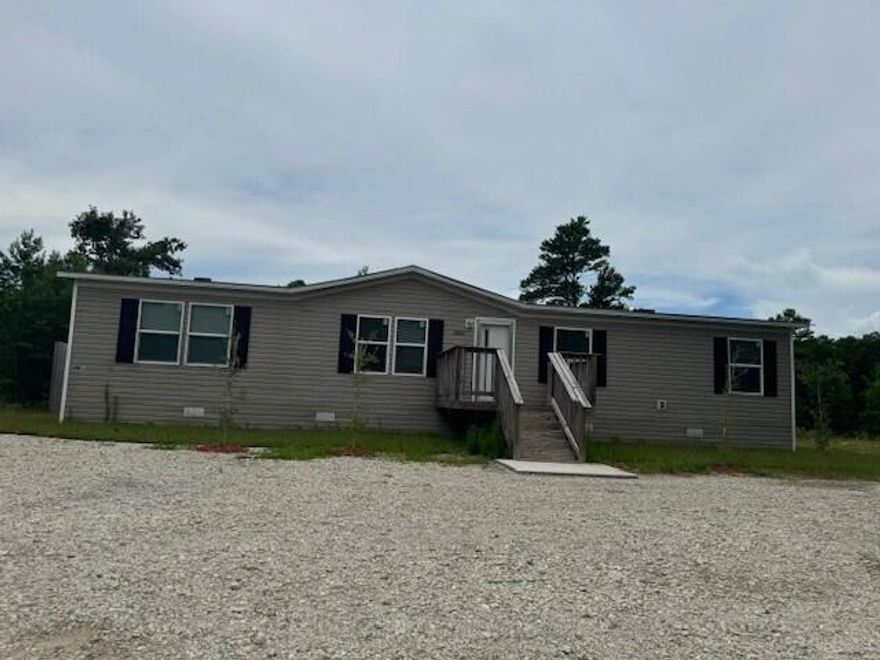 Welcome home to this 4 bedroom/ 2 bathroom mobile home that sits on a 1 acre lot.  The home is in the secluded, quite Southport area and offers plenty of space to spread out and relax.