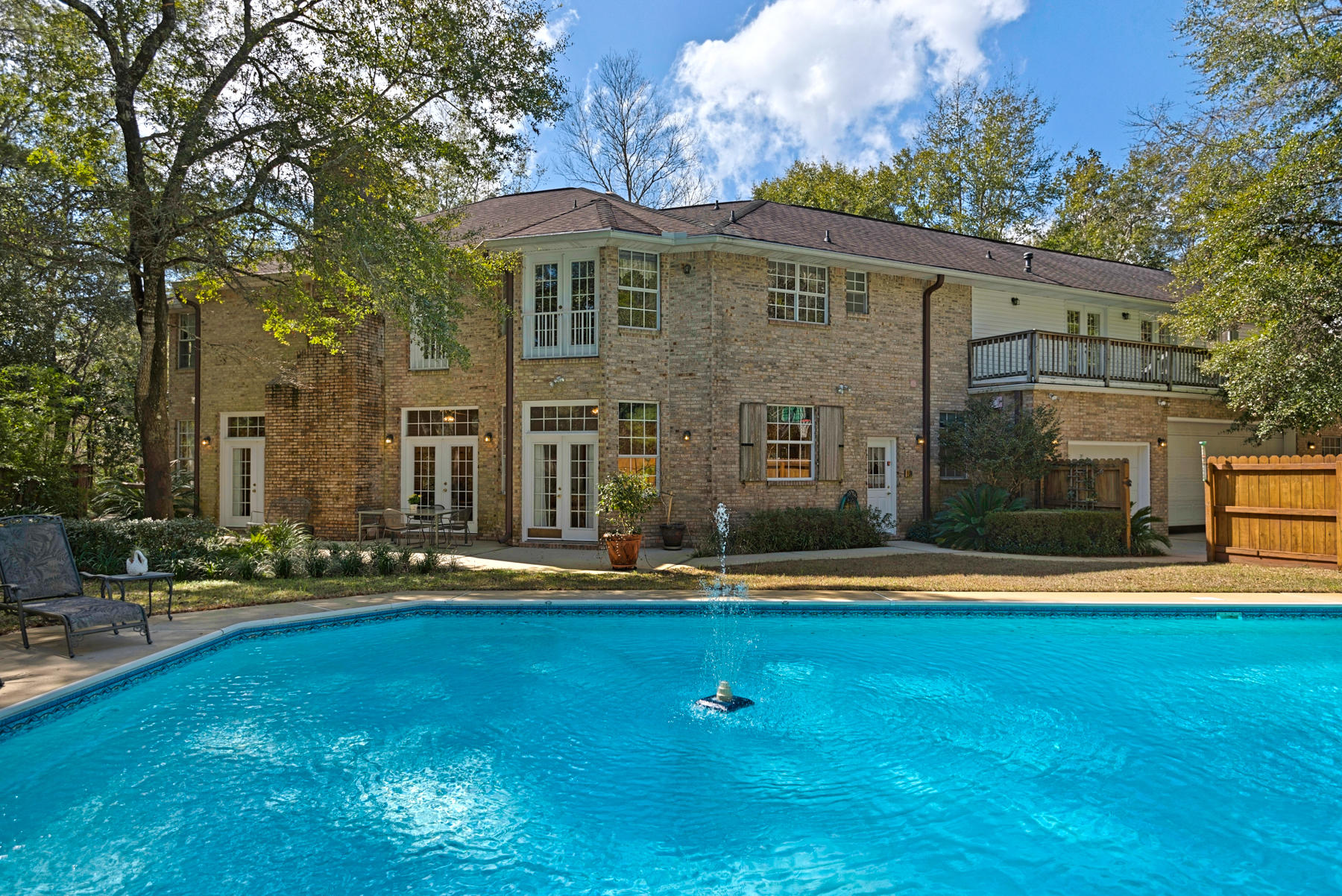 This custom built French-inspired estate sits on over an acre of serene land in Bluewater Bay, complete with a private swimming pool. This is truly your dream garage set-up, with over 2,361 sq ft to accommodate 5+ cars, a boat or RV garage measuring 37 feet, and plenty of workshop space. The spacious floor plan boasts an oversized bonus room perfect for a home theatre, gym, game room, or music studio. In the living room and foyer, you will be drawn to the grandiose fireplace and timeless chandeliers. This one owner, well-maintained home is equipped with a reverse osmosis water system, whole house back-up generator, and attached 2 bed/2 bath guest apartment.