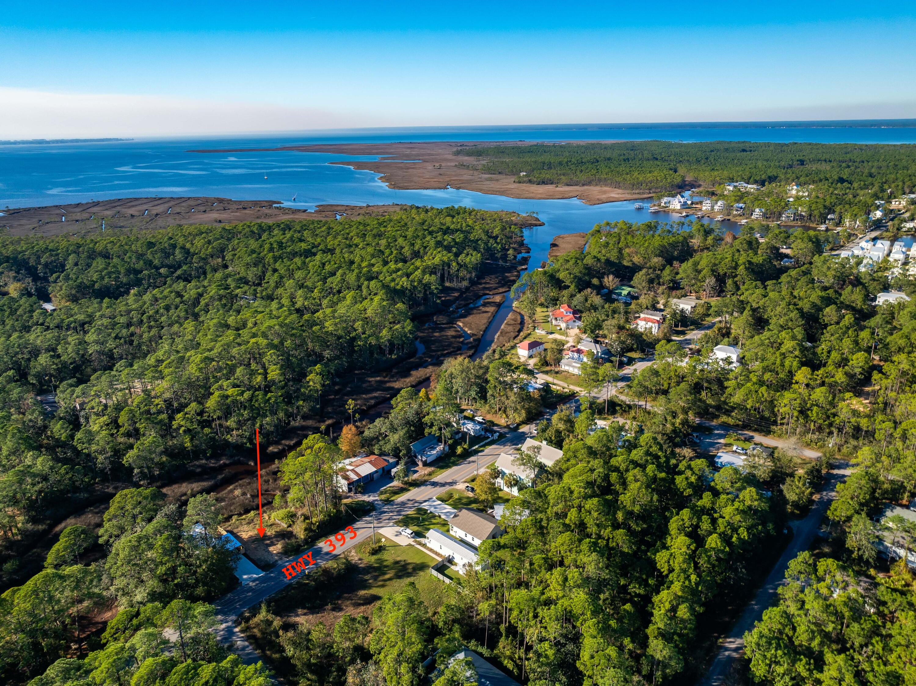 This prime 50x100 vacant lot is perfectly situated at the inlet to the picturesque Hogtown Bayou, offering both stunning water views and a tranquil, natural setting. The property has been fully cleared and is ready for immediate development, providing an excellent canvas for your dream home or investment project.Located in a desirable area with easy access to nearby amenities and local attractions, this buildable lot provides the perfect blend of peaceful seclusion and convenience. Straight shot down hwy 393 to the emerald sand beaches golf cart accessible. Whether you're looking to create a weekend getaway or a permanent waterfront residence, this lot is an exceptional opportunity to enjoy the best of bayou living.