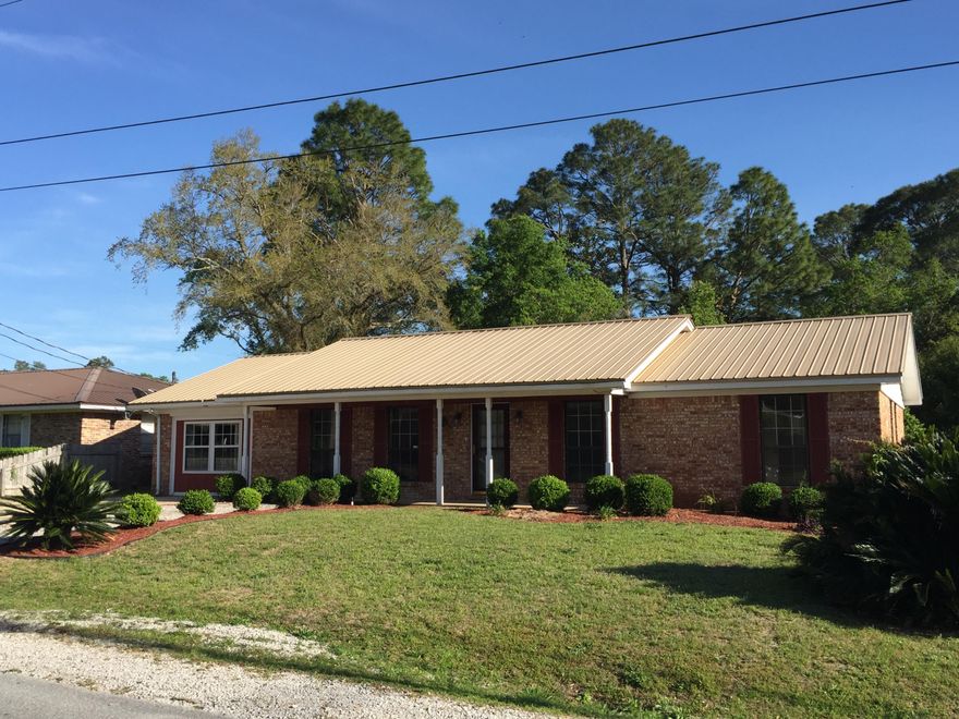 VA QUALIFIED? $500 MOVES YOU IN! Seller will pay all but $500 of your closing cost and pre-paids. Some restrictions and limits apply. This centrally located home has 3 bedrooms and 2 full baths and is walking distance to dining, schools and shopping. There are two living areas, one that was a converted garage space that could be used as a fourth bedroom, office or media room. The kitchen has been recently renovated with a modern tile counter top and stunning accent tile backsplash. The home features a low maintenance metal roof and a site built workshop in the back complete with electricity. It has a large fenced yard and an oversized deck perfect for those summer cook outs. There is no carpet in this house and everything has been freshly painted. Call for an appointment!