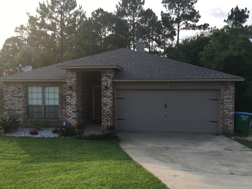 This home is the most private home in the neighborhood. This custom 3 bed two bath is nestled on a totally private cul-de-sac, corner lot. When you enter this home you will notice the open concept plan with vaulted ceilings and laminated flooring. The fireplace is surrounded by custom built ins with granite tops. The kitchen is huge with extended cabinetry, work island, breakfast bar, granite countertops and stainless appliances. The master bedroom is isolated with a huge walk in closet, double vanity and two person shower in the master bath. The lot is surrounded by trees in the back. The cul-de-sac offer extra parking and an area for bicycles and basketball hoops. There are stairs that conveniently lead to the back yard.