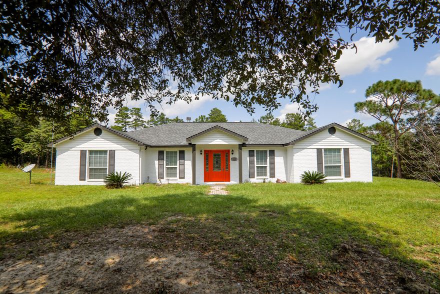 Back on Market at no fault of seller! Solid Brick 5/3 home built in 2018 with 2438 SF living space and trails throughout the 4.8 Acres. New Paint In & Out. Updated large open Kitchen with New Stainless Appliances. New Laminate flooring throughout main areas, Luxury Vinyl in bathrooms and Carpet in Bedrooms. Some new lights/fans. Lots is being cleaned up over next 5 days. Road is in process of being paved. Move in ready!! Room sizes approx. buyer to confirm.