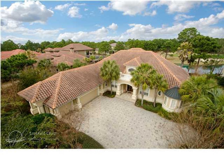 Exquisite home located inside the gates of Burnt Pine. This one-owner Custom Sweet Home has been beautifully updated by the original builder. As you enter into the foyer you will be impressed with all the designer details you will find in the formal living room, formal dinning, wet bar and views of the lanai with its shimmering pool, hot tub, outdoor cooking, bathroom with pool access and views of the lake and Golf course. Perfect for entertaining, the large open kitchen is dreamy with an abundance of cabinetry topped with granite, and beautiful glass tile accents. WOLF appliances installed in 2013,also a SUB-ZERO refrigerator. Kitchen opens into the spacious informal living that boast a contemporary vibe with the back lit entertainment cabinetry,(three flat screens-two hidden