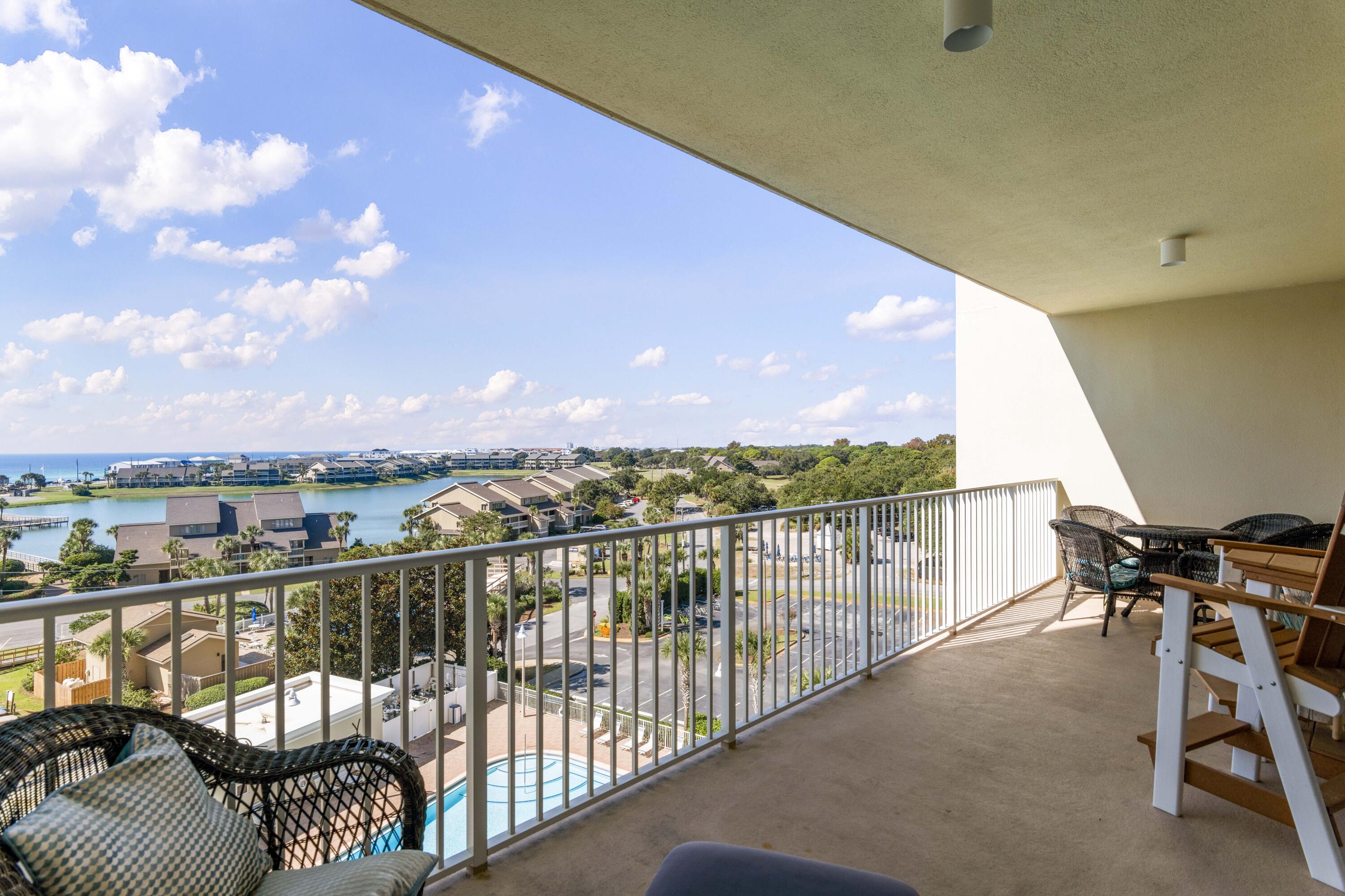 Price improvement on this adorable condo! ''Island Lullaby'' is ideally located on the 6th floor of Ariel Dunes II, giving it the perfect view of the beach and sunset over Seascape Resort's Stewart Lake.  A spacious balcony, accessible from both the living area and the primary bedroom suite, is the perfect place for morning coffee or evening cocktails, or relax inside with updated furnishings, electronics, and a fully-equipped kitchen. With ample sleeping space for 7, you'll find this to be an outstanding turnkey rental property, or keep it all to yourself as a second home.  Ask your agent to compare the price of this condo to recent sales in the building, and you'll see the outstanding value of the property as well. Building amenities include three large pools, fitness center, Cabana Cafe, and large grilling area. Ariel Dunes II owners and guests also have access to all of Seascape Resort's amenities, including 2 other pools, 7 tennis courts, 3 pickleball courts, deeded beach access, and golf. (Inquire at pro shop for golf course rates.)