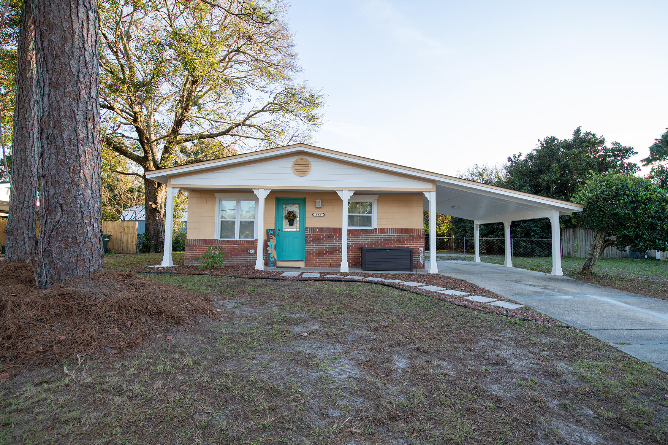 Calling for highest and best offer no later than Sunday 1/16 @ 7PM. This lovely home is as cute in person as it is in photos. It's light and bright and full of sunshine. The kitchen is perfect for entertaining, especially with the island to gather around. Bonus, indoor laundry hook-ups. Covered parking that enters into the side kitchen door is ideal for those rainy or hot summer days in Florida. Last but not least, a large fenced in back yard.