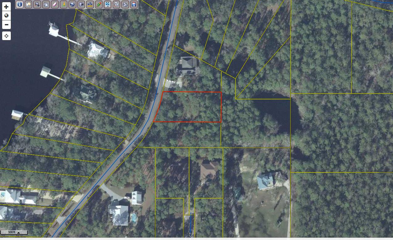 Large 1/2 arce lot in Freeport. No wetlands, across the street from the Bay. Build your dream home close to shops, bay and beautiful beaches of South Walton.