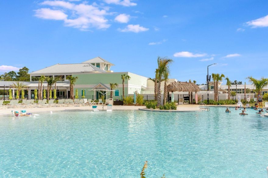 Welcome to Latitude Margaritaville Watersound, a luxurious 55+ gated community on Panama City Beach! This beautifully-designed, one-owner, single-level, Tortola Villa offers 2 bedrooms, 2.5 baths, a den/flex room, covered lanai, 2 car garage and 2,362 square feet under roof! Seller is also offering a $10,000 credit for flooring so you can upgrade the flooring to what you desire. This 2023-built, highly-upgraded Villa is so welcoming and you'll love enjoying the indoor-outdoor living we love in Florida for all months of the year. As you step into this Villa, you'll find 9' ceilings, an open concept kitchen, living and dining area. A kitchen island with beautiful granite countertops and upgraded stainless appliances is perfect for entertaining guests and sipping on margaritas...because it's always 5 o'clock somewhere!  HUGE upgrades here you will benefit from: Impact Windows, Impact Doors and Impact Garage, Lighting, Electrical Upgrades throughout. and more!

The living room features a tray ceiling to 10' and a large sliding glass door to the covered lanai. A unique feature of the Tortola plan is two primary suites PLUS a flex room! In this split floorpan, just off the living room you'll find a spacious suite overlooking the back yard. This primary suite offers a tray ceiling to 10' and a spacious primary suite bath with double vanities, a tiled shower and a closet you've always dreamed of! 

This true split floor plan makes it great for guests to come visit and offers a full bedroom and bathroom on the front of the home. An added den is also great for flexibility for those who wish to work at home, have a bonus room for crafts or even additional sleeping space if desired. Add in a powder room and this one makes this the most desirable Villa in Latitude Margaritaville! The laundry room is large and offers upgraded cabinetry with direct access to the 2-car garage. 

This home offers the following as upgrades: hurricane rated impact windows and doors, impact hurricane rated garage door, window coverings, granite countertops, tiled showers, glass shower enclosure in rear primary suite, undermount sinks, 8' doors, recessed lighting throughout and white shaker cabinetry.

Do not miss this opportunity to live in this gated community and start living your best life in Latitude Margaritaville Watersound! This community offers remarkable amenities where you'll enjoy a fitness center, movie theater, pet spa, business center, workshop, restaurants, resort-style community pool with beach entry and swim-up bar, tennis and pickle ball courts, bocce ball courts, kayak launch & more. 

Ideally located just minutes from the sandy beach, this Jimmy Buffet inspired community is a destination where it's always 5 o'clock somewhere! Inquire today to begin living your best life!