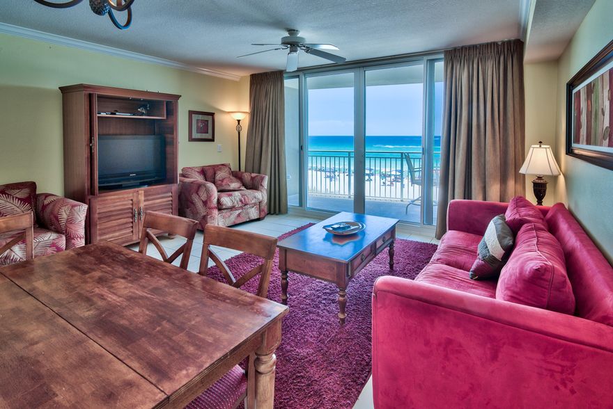 Located just over a mile east of shopping, dining, & entertainment at Pier Park is Emerald Beach Resort Condo. Set along nearly 800 ft of beach front along the Gulf of Mexico in NW Florida on the grounds of a five-star waterfront resort, it features access to luxurious amenities that include multiple pools, an exceptional fitness center, Starbucks, valet parking, and 24-hour security. The building features an enclosed walkover with upscale Sky Bar lounge. Jet ski and parasailing rentals are offered on site seasonally. Easy care tile floors carry throughout the entirety of this gulf front unit with hall bunks, and crown molding adds a finishing touch. Its kitchen with bar seating is appointed with contemporary raised panel cabinets, granite counters, and stainless steel appliances.