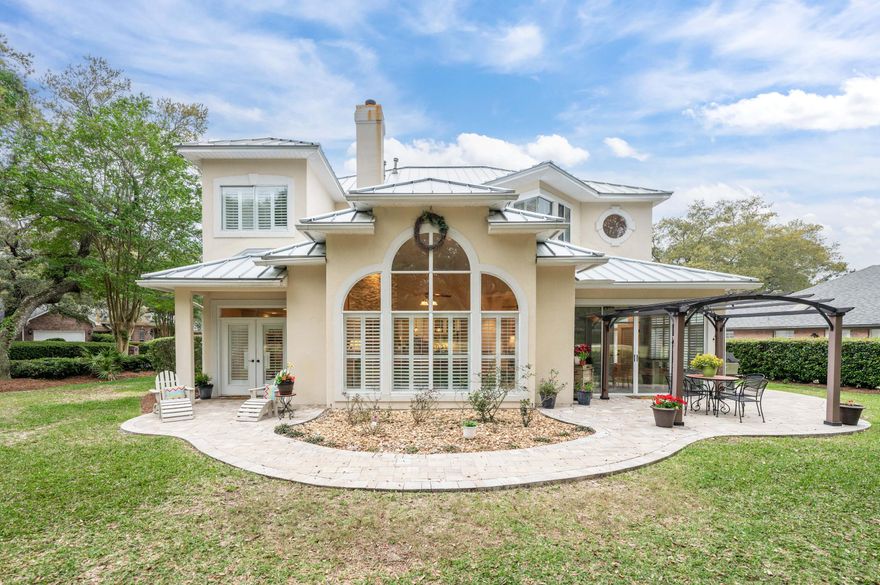 Absolutely stunning property located in the prestigious, gated community of Southwind in Bluewater Bay. This home has outstanding dimensions of architecture built by Porter Construction. The maximum lighting throughout the house and the creativity of space by design of the lot on the 2nd fairway of the Marsh Course makes it a true gem. From the moment you arrive, you will be in awe. The circular driveway with two entry points makes for easy access and plenty of parking. This beautiful home has undergone recent upgrades including a new metal roof in 2021 and a new water heater in 2023. The first floor now has new tile floors throughout. The natural light makes the home vibrant and rich. The moment you enter the front door with transom you will see the sunlight reflections in the entryway.