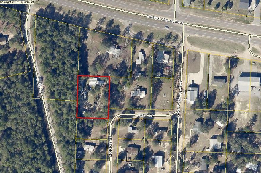 Nearly three quarters of an acre located just outside of town. With convenient access to shopping, restaurants, and Main Street this property may be just what your looking for. Formerly the property held a mobile home, workshop, and 32' motor home carport. Currently the only structure on the property is a workshop.