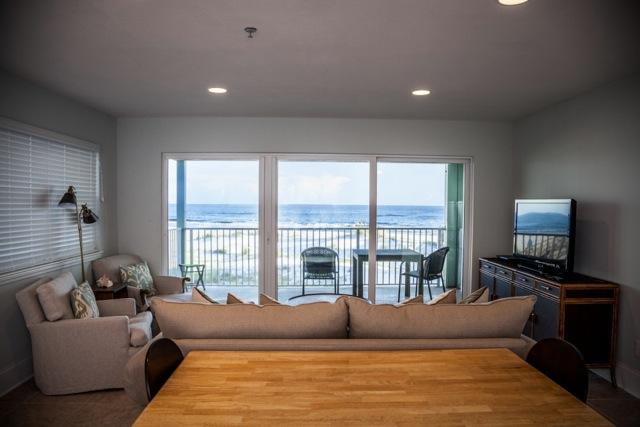 Commodore's Retreat is one of the best-kept gulf-front secrets on 30A! This highly desirable corner unit - with views of the beautiful gulf in front of you and one of 30A's rare coastal dune lakes to your left - won't last long. The wonderfully secluded beach allows you to get away from it all - but it's only about a mile from Seaside and all it has to offer. Put this on your 'must see' list! The unit is tastefully furnished in a comfortable coastal motif with new tile flooring throughout. With a king size bed in the bedroom, bunk beds in the hall and a queen sleeper sofa in the living room - you can sleep 6 easily. The latest hurricane rated sliding doors open onto your private deck and those breath-taking views. This first floor unit is actually like being on the second floor because