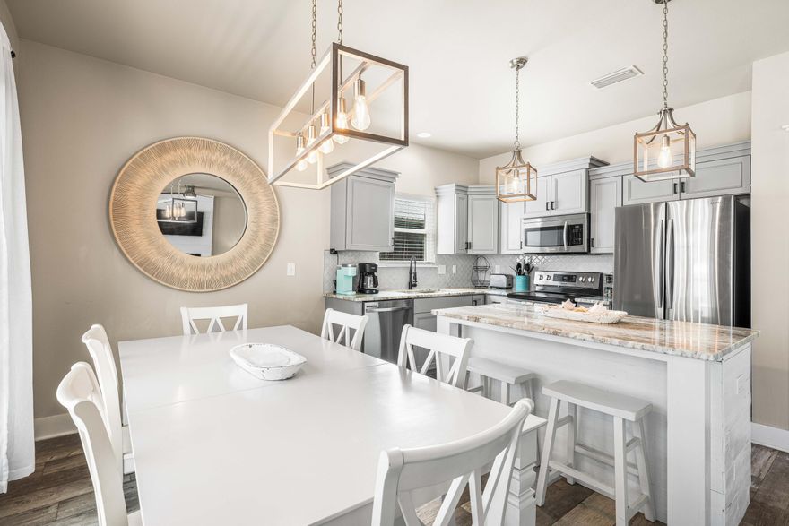 A rare opportunity to step seamlessly into the Santa Rosa Beach lifestyle, this three-bedroom, two-bathroom bungalow offers the flexibility today's buyers crave. Already established as a successful vacation rental with proven income history, it also lives beautifully as a full-time residence or second home near the coast. Built in 2020 and thoughtfully finished from exterior to interior, the home welcomes you with generous double parking and a wide staircase leading to a spacious front porch complete with a custom swing -- the kind of spot made for slow mornings and evening breezes. Inside, soft neutral tones and wide-plank LVP flooring create a relaxed coastal aesthetic throughout the open living, dining and kitchen areas. Granite countertops, coastal gray cabinetry and an attractive backsplash frame a kitchen designed for both everyday living and entertaining. A built-in electric fireplace anchors the main living space with warmth and character while natural light fills the interior. A custom barn door conceals the oversized laundry area and leads to a convenient side exit, keeping daily life practical and organized. Both bathrooms feature beautifully tiled showers that add a polished touch. Out back, the scale is a true standout. The oversized fenced yard offers ample room for gatherings, pets and play -- even future pool plans -- with a spacious deck, pavered walkway and firepit creating an inviting outdoor setting. Whether hosting friends after a beach day or unwinding beneath the stars, this backyard was built for real outdoor living. With no HOA restrictions, flexibility is built in. Public beach access at Ed Walline Regional Beach Access and Blue Mountain Beach is just minutes away, along with 30A dining and shopping. Boating enthusiasts will appreciate being just five minutes from Cessna Landing Boat Ramp, which offers easy access to the bay and open water. For those seeking a smart investment, a great starter home or a coastal retreat with room to grow, this property offers space, style and location in equal measure.