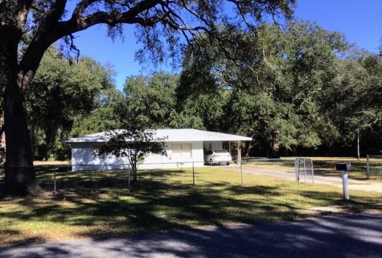 2 bed 2 bath cinderblock home on three .49 acre lots. Roof replaced 2018
