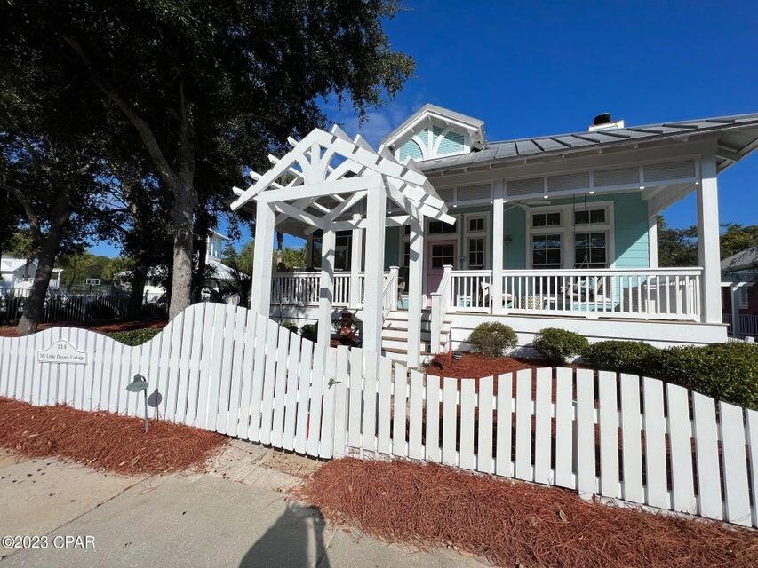 ''My Little Dream Cottage'' is a charming and quintessential 3 bedroom, 3 bathroom, one story beach house with a bunkroom and children's den, located in Carillon Beach. This custom designed home has an open floor plan, three sided wrap around porches and loads of upgrades, including tongue-in-groove ceilings, wainscoting, built-ins, transom windows, hardwood flooring, fireplace, granite counter tops, luxurious baths, custom closets and designer kitchen with island, breakfast bar and stainless steel, energy rated appliances. The screened in side porch faces the Bellview park and pool, and there is gas firepit in the backyard and a shed that has been converted into an office. The home is just a short stroll to the Beach!