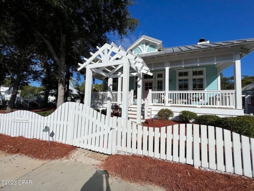 ''My Little Dream Cottage'' is a charming and quintessential 3 bedroom, 3 bathroom, one story beach house with a bunkroom and children's den, located in Carillon Beach. This custom designed home has an open floor plan, three sided wrap around porches and loads of upgrades, including tongue-in-groove ceilings, wainscoting, built-ins, transom windows, hardwood flooring, fireplace, granite counter tops, luxurious baths, custom closets and designer kitchen with island, breakfast bar and stainless steel, energy rated appliances. The screened in side porch faces the Bellview park and pool, and there is gas firepit in the backyard and a shed that has been converted into an office. The home is just a short stroll to the Beach!