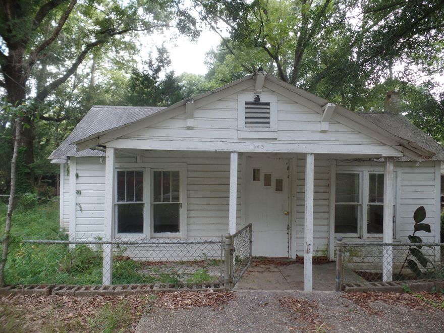 Investors wanted! This house had tons of potential and character. Was used previously as a rental. Large fenced back yard with spacious out building. Owner has 3 adjoining properties and is willing to sell together. Property is sold ''as is.'' Buyer needs to verify all square footage that is important to them.