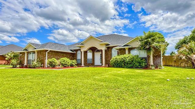 Step into elegance and space with this stunning 4 bedroom, 3 bath home, beautifully crafted by a renowned semi-custom builder and packed with upgrades from top to bottom! Located in a serene neighborhood, this all brick beauty boasts almost 3,000 sq ft of stylish living with soaring ceilings, custom finishes, and a rare 3 car side entry garage. You will love the expansive open layout, including a formal dining room with recessed lighting, a flexible bonus room perfect for an office or 5th bedroom, and a light filled Florida room overlooking the backyard. The chef's kitchen is a dream, featuring stainless steel appliances, upgraded cabinets with crown molding, a wraparound breakfast bar, and walk in pantry. This luxurious suite offers a spa like bath with dual vanities. Do not miss out.