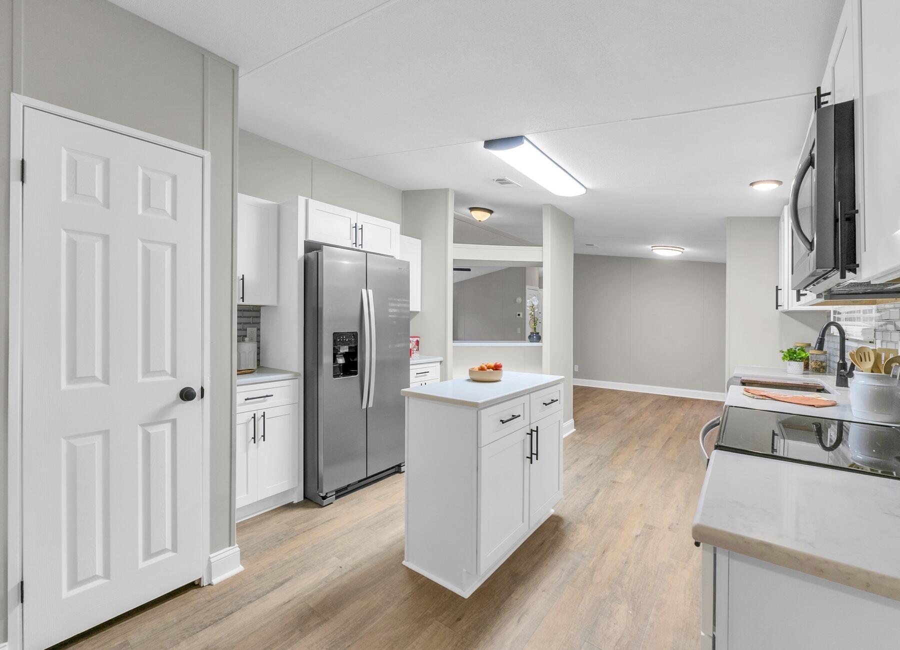 100% Move in Ready-- 2023 roof,ac and hot water heater.. 100% Updated Home on 2.6 Acres! 4/2 2100 Feet! Updates-New kitchen with granite and stainless steel appliances, New baths, ,new paint, new fans and lights, new flooring, New 1-6 wrapped around trailer skirting.