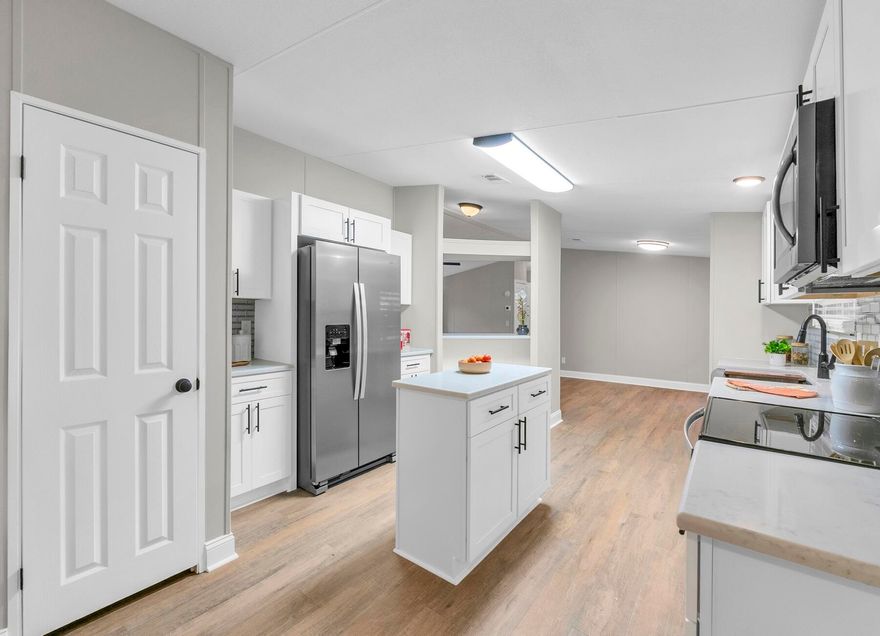 100% Move in Ready-- 2023 roof,ac and hot water heater.. 100% Updated Home on 2.6 Acres! 4/2 2100 Feet! Updates-New kitchen with granite and stainless steel appliances, New baths, ,new paint, new fans and lights, new flooring, New 1-6 wrapped around trailer skirting.