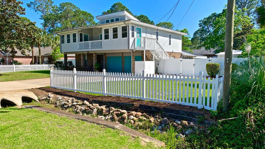 Enjoy Bay Views from this home in Highly Sought after Holiday Shores Estates. Directly across from a Bayfront Park! 2 Bedrms, Laundry & Spacious Garage downstairs. Kitchen, Living, Dining, Master & bedrm upstairs. Customize this home to your liking. It has great potential & some very nice features. Gourmet Kitchen w/ Oak Cabinets, Granite Countertops, Stainless Appliances, Double Ovens, 5 Burner Gas Stove w/ hidden slide up extractor & dumbwaiter/lift  from the downstairs laundry room to the kitchen. The Sizable Granite Island is perfect for entertaining! Open & Spacious Living/Dining Rooms, Large Master Bedrm, Lovely Hardwood Floors, Florida Room & Balcony Overlook the Bay. Huge enclosed Pool, Workshop, Golf Cart Garage, Large Fully Fenced Backyard! 10yr Roof, New Water Heater, 4yr A/C!