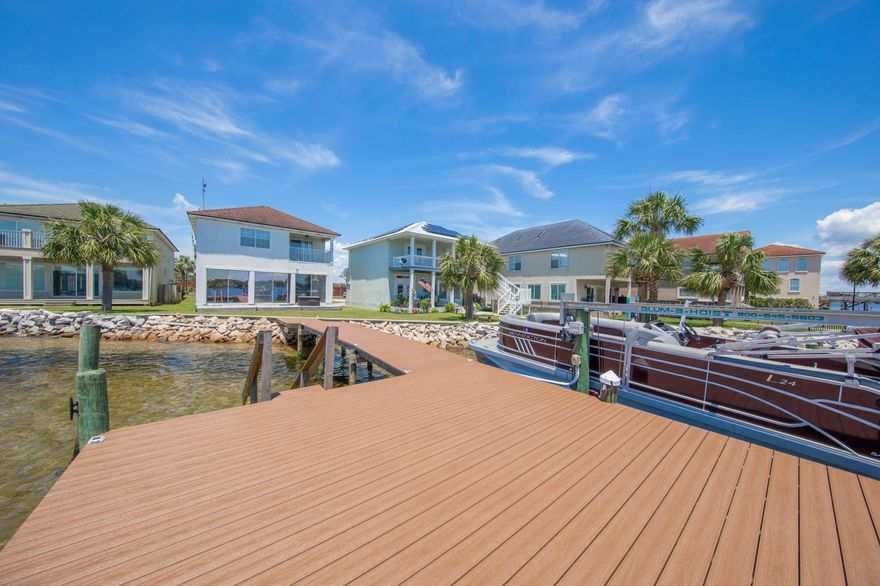 No need to wake up--this isn't a dream. You actually live here now. The white sandy beaches draw thousands to our emerald coast, but bayou living captures the hearts of many locals. Welcome to your waterfront sanctuary on the bayou of Fort Walton Beach.  Bayous make boating, paddleboarding, tubing, and jet skiing a lot less bumpy. Now, picture hopping into your boat, filling up at the marina just two minutes away. 5 minutes later docking your boat to  indulge in waterfront dining, graced by breathtaking views. Or 15 minutes later,  rendezvousing with friends at the famous Crab Island. When you're not out living your best life on the sparkling waters, retreat to your private dock, where the sun continues to bathe you in its golden glow. Throw in a line and catch dinner. Or head inside to relax in that quenching AC.  Open up the blinds to continue watching the marine life on display.  Jumping dolphins and diving pelicans are always an amazing show.  You've lived today! Too tired to think? No worries.  Your house forecasted this, as there is a master bedroom on both the first and second floor. Sleep wherever you want.  But, if you can get upstairs after the fun,  the master bathroom shower will be as enjoyable as your best day on the beach.  "Lighthouse" pointe is perfectly named. This community will "guide" you to unparalleled  living, where every day is a harmonious blend of adventure and  relaxation.