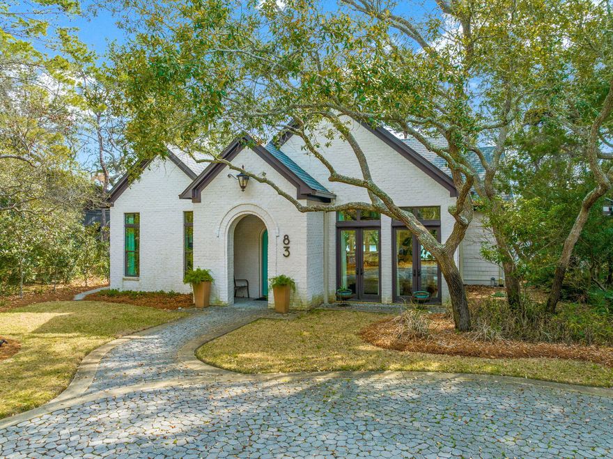 This pristine four-bedroom brick home offers a superb living experience in a picturesque lake front setting. Situated on a high lot overlooking Eastern Lake with 85 feet of frontage, it provides easy access to the Gulf of Mexico, either by a short paddle or a leisurely stroll. The custom multi-tiered decking enhances the outdoor living experience, creating a peaceful and beautiful environment to enjoy scenic Eastern Lake. The expansive windows in the kitchen and living areas showcase breathtaking views of Eastern Lake, framed by the unique oaks that surround the property. The house boasts a dream kitchen that is sure to delight any culinary enthusiast and is a foca high-end appliances such as Wolf Stove and Asko dishwasher. Custom-made Kraft cabinetry with automatic closures adds a touch of sophistication. The gourmet kitchen is designed for both functionality and style, providing an ideal space for cooking and entertaining. 
The 1st-floor master bedroom is a tranquil retreat, complemented by a stunning master bathroom. 

On the 2nd floor, there is another master suite with a private balcony, providing an additional vantage point to enjoy the scenic surroundings. Two more bedrooms on the second floor ensure ample space for family or guests.

This excellently maintained home is versatile and well-suited for various purposes, whether as a full-time residence, a vacation home, or a rental property. Its sophisticated design, high-quality amenities, and a perfect location makes it unique and ideal for a 30A Dune Lake Home. 
  Buyer to verify all information and measurements deemed important.
