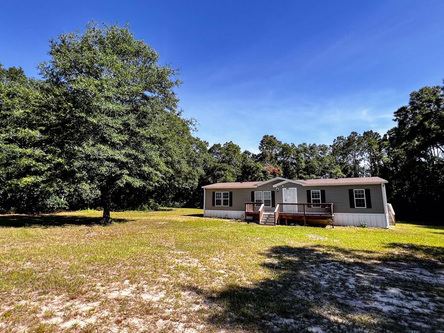 This stunning newer manufactured home offers all the space and features you desire for comfortable, contemporary living. Sitting on a generous .77-acre lot, you'll enjoy the perfect blend of in-home amenities and outdoor tranquility. Inside, you'll be greeted by a modern kitchen featuring a large island, ideal for meal prep, entertaining, or dining. The spacious walk-in pantry provides ample storage for all your culinary needs.Relax and unwind in the luxurious master suite, featuring a spa-like master bathroom with a relaxing garden tub and a separate shower for a truly rejuvenating experience.Step outside and take in the fresh air on the front porch which will make a great place for enjoying your morning coffee. This move-in-ready gem won't last long! Schedule your showing today!