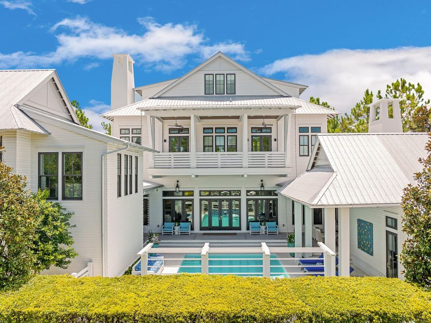 Positioned on one of the largest - if not the largest  - homesites in all of WaterColor and thoughtfully brought to life through a collaboration between renowned architect Geoff Chick, the homeowner, and Cara Richardson of award-winning Lovelace Interiors, 191 Sand Hill Circle is a residence defined by intentional elegance, architectural integrity, and elevated livability. Framed by a peaceful pocket park in front and the preserved beauty of the state forest behind, this 8,314-square-foot estate stands as one of the community's true masterpieces. Every detail of this seven-bedroom, seven-and-a-half-bath home has been artfully curated, from Venetian plaster walls to a whole-home Control4 system that manages lighting, sound, climate, and security. Custom artisan lighting, curated furnishings, and dramatic accents, such as original works by award-winning artist Mary Hong, create a home that is both visually striking and deeply livable. Each bedroom features an ensuite bath with dual vanities, custom tile from Q-Tile, and high-end, bespoke bedding.

The chef's kitchen is outfitted with Wolf and Sub-Zero appliances, complemented by a butler's pantry with a second oven and dishwasher. Three laundry rooms ensure effortless convenience, while the owner's retreat  secluded on the second level  features electric drapes, serene views, and access to expansive porches.

Outdoor living is equally refined. The resort-style pool is flanked by two covered pavilions: one side features a fully appointed outdoor kitchen and grill, while the other boasts a posh gathering area complete with a fireplace and TV. A full pool bath and lush, irrigated landscaping complete the setting, enriched further by elegant rain chains and peaceful sightlines.

The home also features a posh carriage house above one of two climate-controlled two-car garages, making it the only residence in WaterColor to offer this level of vehicle and guest accommodations, along with two additional parking spaces. Blending art, technology, and lifestyle  and offered mostly furnished, including a GEM car and two electric bikes  this exceptional property was honored as the cover feature in Florida Design Magazine. This is not just a home; it is WaterColor's most exquisitely crafted residence and a once-in-a-lifetime opportunity to own a true generational estate on 30A.