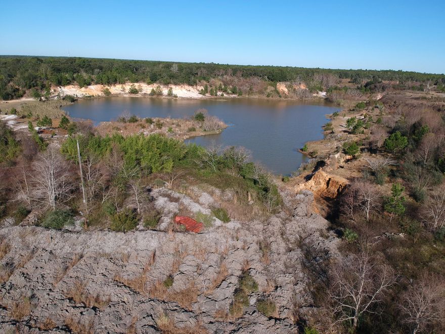 The acreage was once owned by Coyote Land Company, Inc. It operated as a C&D Landfill. Property is located on the east side of Highway 87. Take a right on Five Forks Road. Property starts at the corner of Nuthatch Road and Five Forks Road on the north side of the road. Property would be great for a construction/trucking yard or storage. Buyer needs to do all of the necessary due diligence to verify acreage, any environmental concerns and property use.