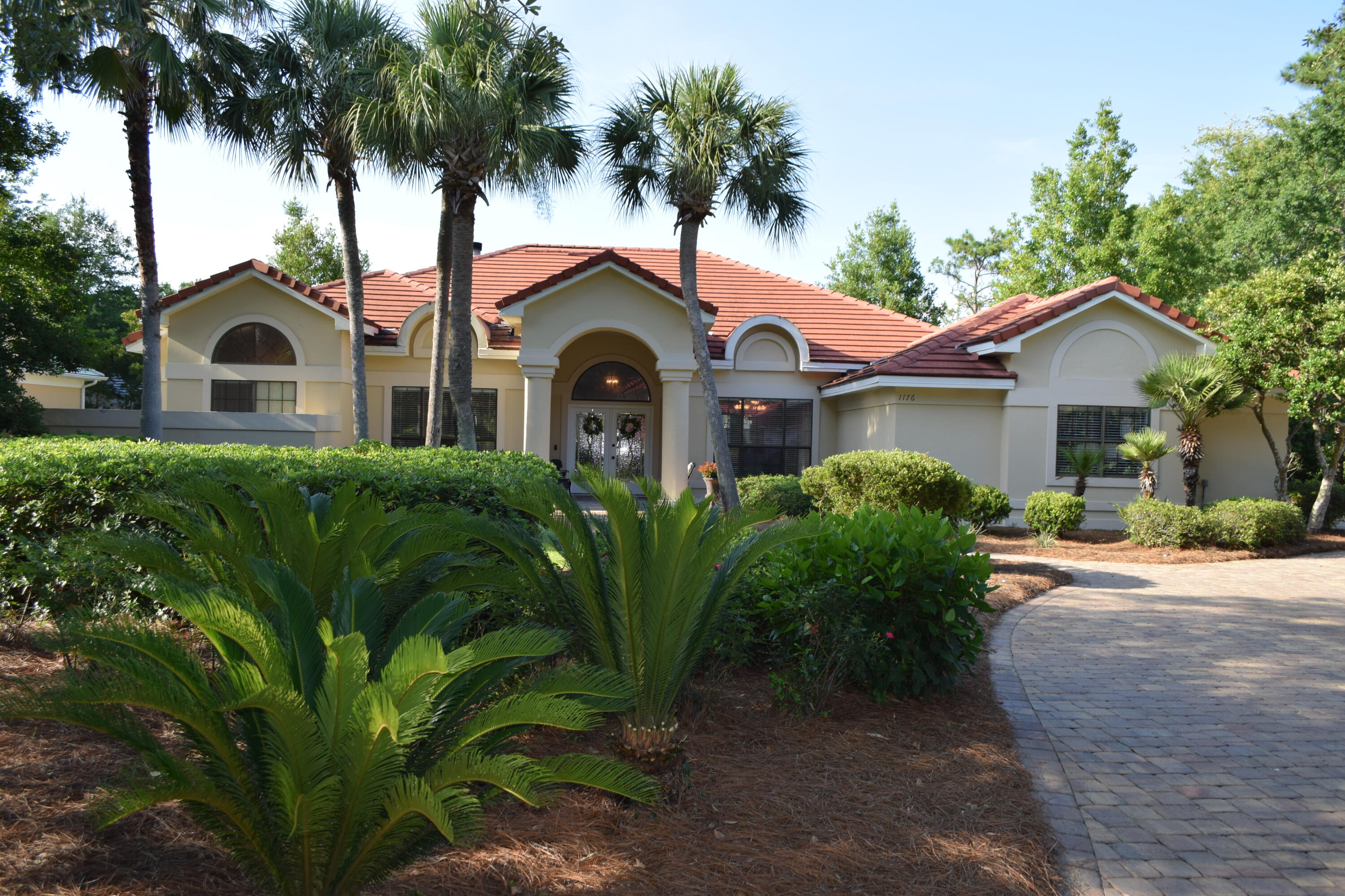 Exquisite home nestled in desirable Sandestin with recent updates, including porcelain plank flooring throughout, master bath, half bath, paver driveway, two new hot water heaters, most kitchen appliances new, new tile roof in 2017 and fabric hurricane shutters.. Seller will include a 1-year paid home warranty through American Home Shield. Sprinkler system on a well. All of this in desirable Sandestin which is golf cart accessible to the beach, restaurants, bank, shopping, hospital, doctors' offices, and four fantastic golf courses. Our 4-person golf cart will convey with the sale. Non short-term rental community; low HOA fees. Some furnishings negotiable. Seller is a licensed real estate broker.