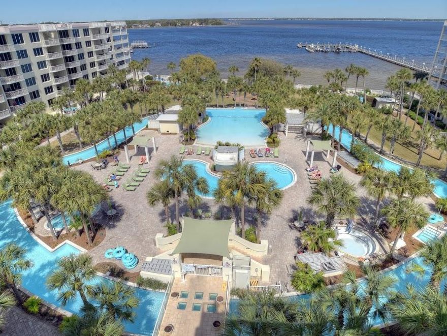 Own the best 1 bedroom penthouse on the market! This penthouse end unit offers an open floor plan with 9 foot ceilings, one master bedroom, a bunk room, and 2 full bathrooms.There's even a rooftop patio! Utilizing the sleeper sofa, this condo can accommodate 6. The covered patio off the living area fronts Lazy River lagoon pool, large heated pool, 2 hot tubs, and pleasing lush landscaping. Climb the stairs from the living area patio and enjoy the rooftop views of the bay and the Gulf, all the way to Destin! There's also a patio off the master bedroom. Calming desirable decorating and well maintained, this unit is rental ready Present owners didn't rent the unit. Destin West Gulfside and beach are accessible by a catwalk on the 3rd floor over Hwy. 98. Seller to include home warranty.