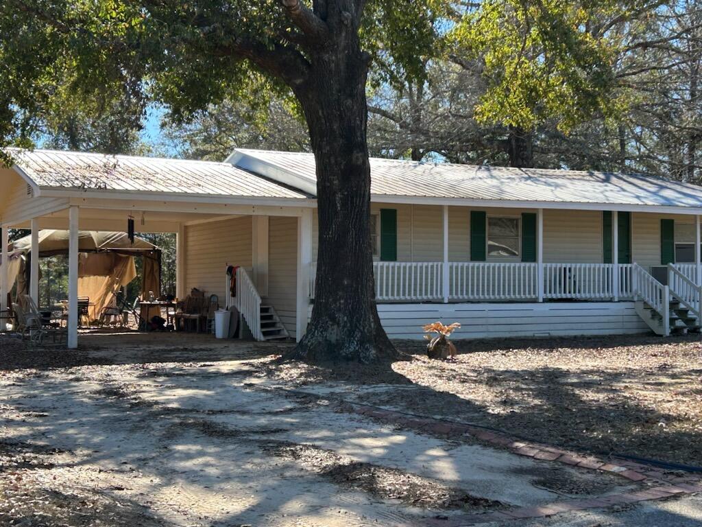 Vinyl siding mobile home located in S/D at Geneva, AL.   Home has been rented to same person for 15 years.  Location is within hour to Santa Rosa beach.  Home has newer metal roof, attached carport and covered front porch.  HVAC is inoperative.  Property is being sold as is with no repairs made by seller.  Cash only.