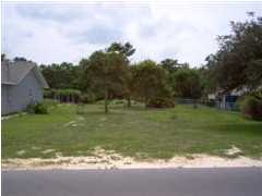 Seller financing available on this fantastic, large (60X125) lot. Walk to the beach - lot is south of 98, west of 79 and approximately 3/10 of a mile from the Gulf. First Baptist Church is now built on a large parcel behind the lot, which affords for plenty of privacy. There is a privacy fence at the rear of the lot. Listing Broker/Salesperson has ownership interest in the property.