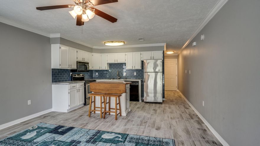 WOW! COME SEE THIS CHARMING NEWLY RENOVATED LARGE STUDIO END UNIT W/FULL KITCHEN, FULL BATH & STACKABLE WASHER/DRYER. Walk down public boardwalk straight to the public beach access in a mere 4 minutes (535 ft.). 2 minutes to the sound (375 ft.). 3 minutes to Stewby's Seafood Restaurant. This is a perfect getaway place or potential rental machine. RENOVATIONS INCLUDE: NEW Wood Plank tiling throughout, NEW crown molding & Paint. NEW bathroom vanity w/light faucet, light, mirror, toilet & tile. NEW Kitchen countertops & backsplash. NEW Lighting. NEW interior doors. 
PLUS: 2019 HVAC. NEWER french doors. NEW back deck. Tiled Porch. Kitchen Island w/pop up bar & Stools. 3 Closets. Storm door. End Unit. Community Pool. This is a spacious studio and is a must see and all for UNDER $170K