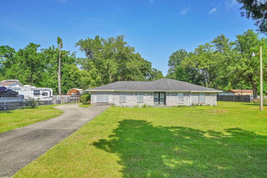 Take a look into this spacious home in Pensacola! Situated on a fully fenced in, oversized lot, this home offers 4 bedrooms, 3 full bathrooms, a dedicated office space, and plenty of living space with 3 separate living room areas. The large driveway that leads you around the house to the garage can accommodate plenty of cars, or a boat or RV. You don't want to miss this ONE!