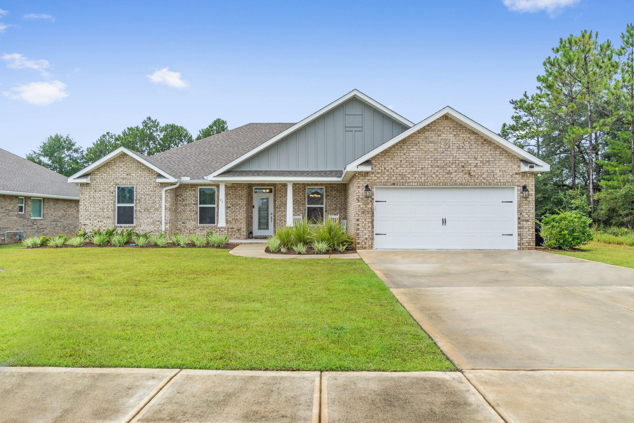 Welcome to this stunning, like-new home on a beautiful lake lot in Hammock Bay. You'll love the tile plank flooring throughout all the main areas, vaulted ceilings, extra lighting, and large driveway for extra parking! Sit on the back screened porch and enjoy evenings watching the birds and turtles in the late. With extra pavers, you have room to entertain all your friends. Inside the home, you'll have a formal dining room and nook along with ample counter space. This open floor plan allows you to be in the kitchen without missing all of the fun. Need to escape?  Just head into your owner's retreat and relax. In this split plan, the other bedrooms and den are across the home.